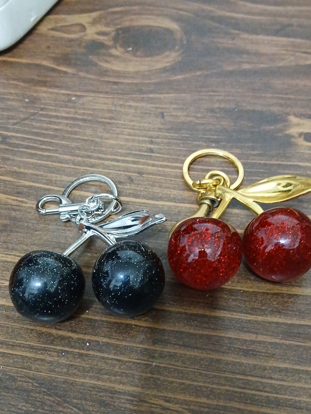 Sparkle Cherry Keychain Pair — Red and Blackone Silver One Gold Set Of 2